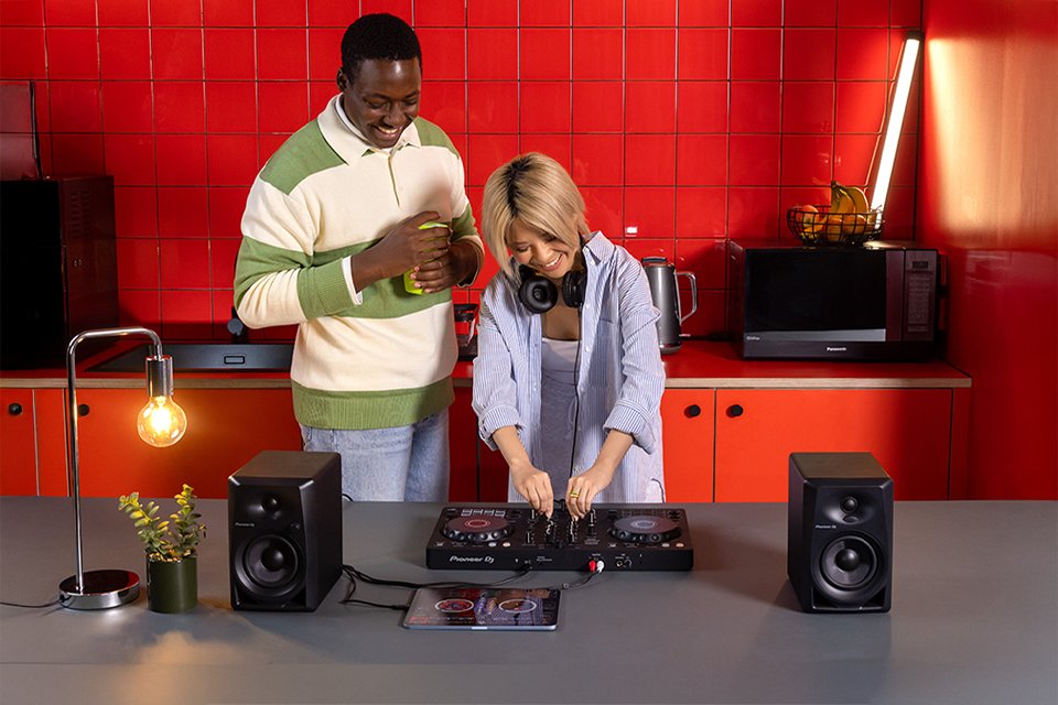 A pair of friends DJing with Pioneer DJ DDJ-FLX4 controller.